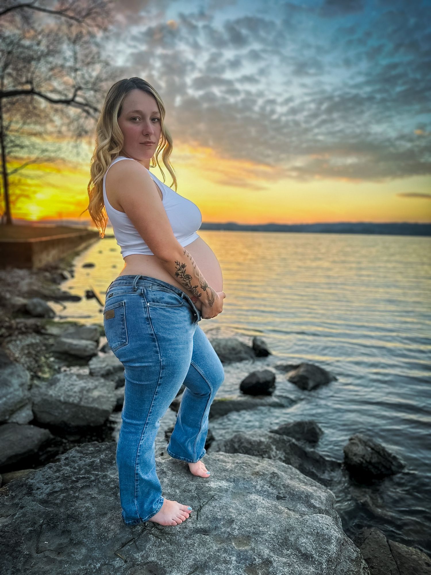 Maternity session in golden sunset field