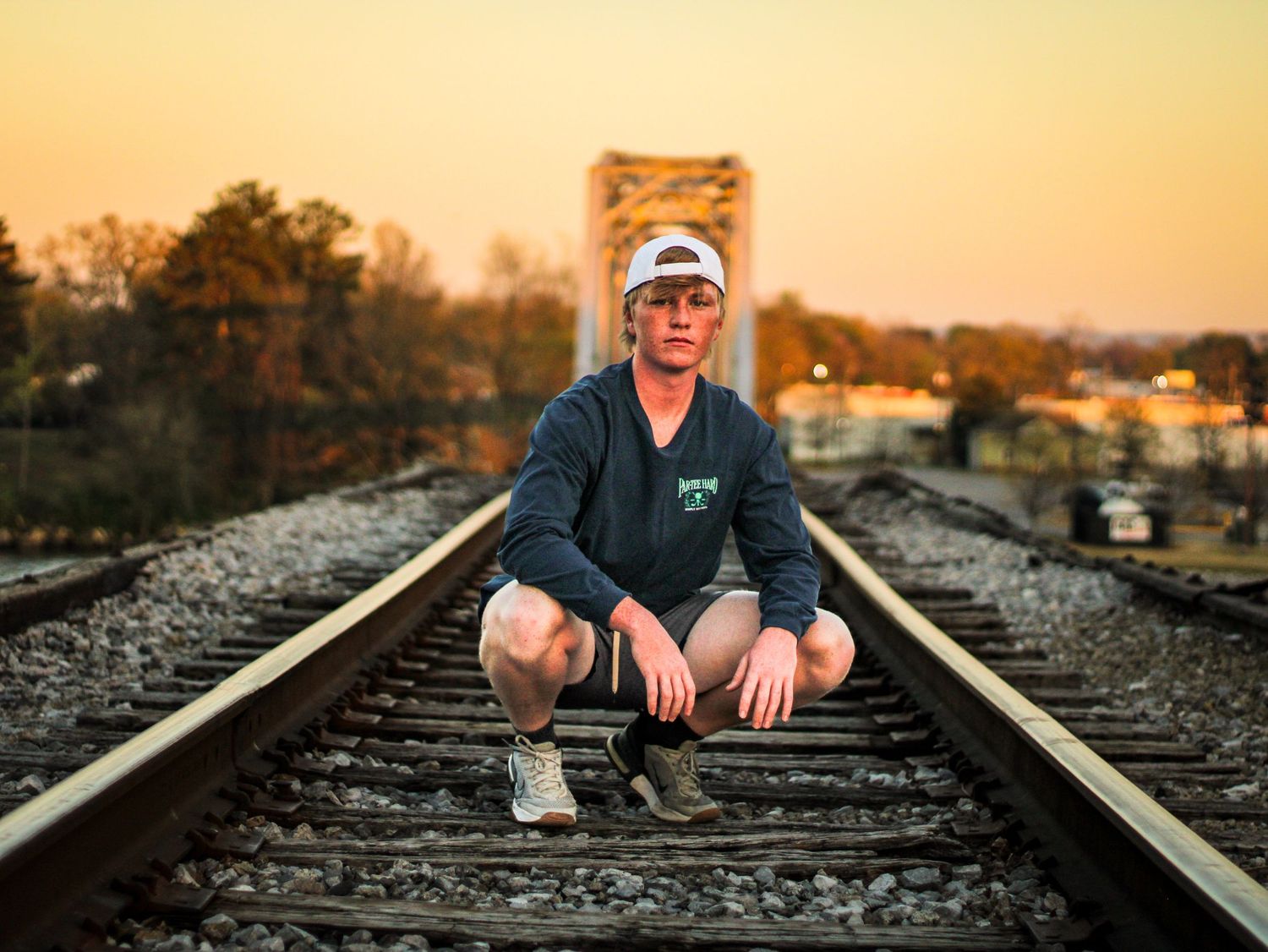 Senior session in tall grass field