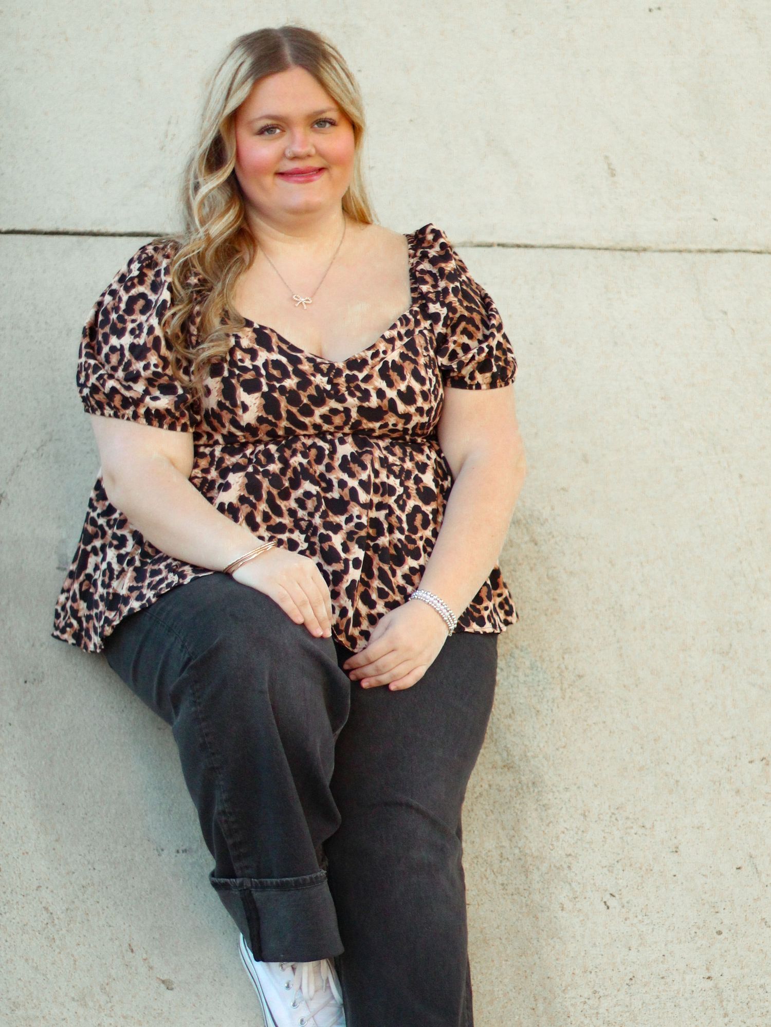 Senior photos with bridge railing backdrop